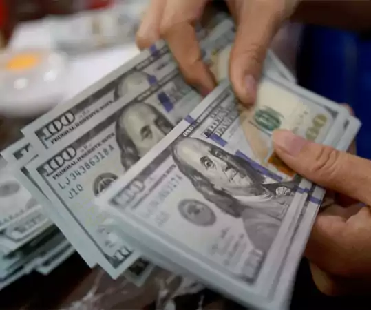 The dollar strengthens while European stocks stabilize
